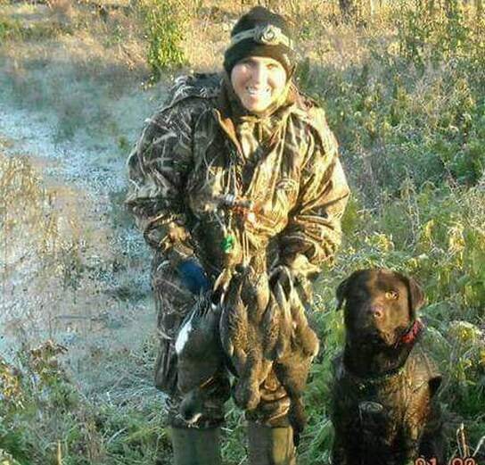 Retriever and handler in a South Texas hunting setting